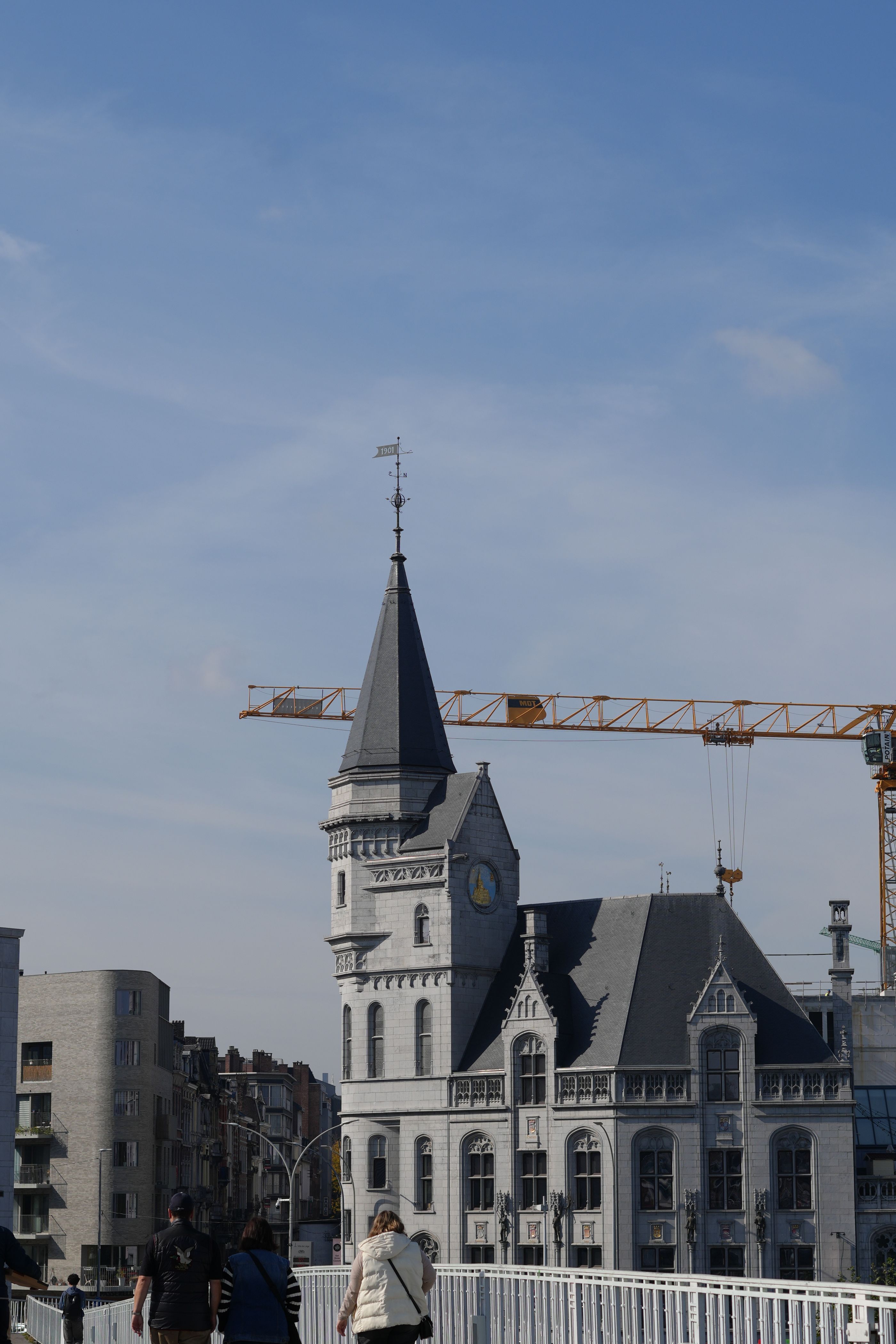 Construction crane over a new residential high-rise in Liège, Belgium