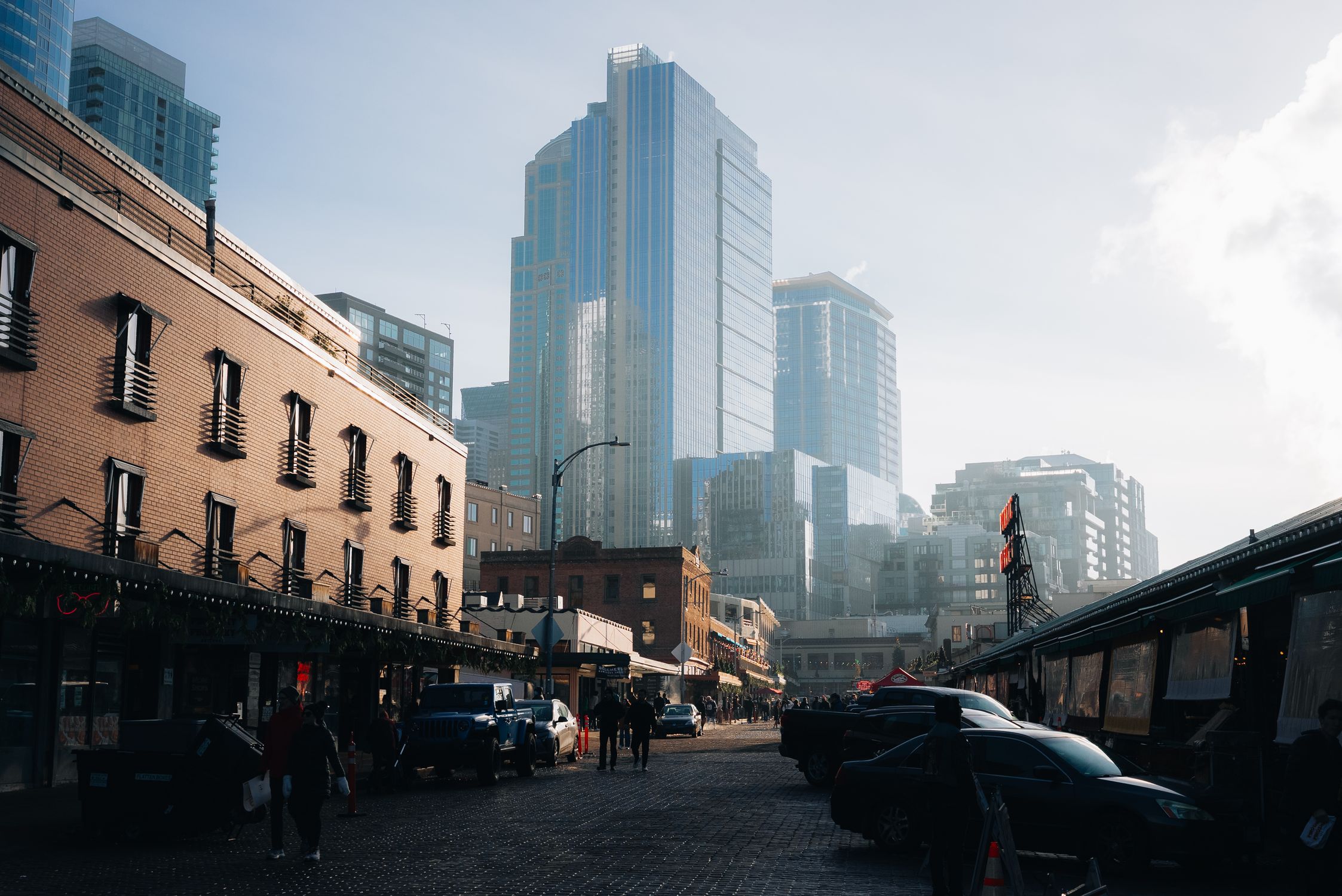 Morning view of Seattle cityscape featuring Pike Place Market and modern skyscrapers.