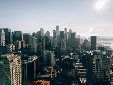 Explore a stunning aerial view of Seattle, highlighting its iconic skyline on a bright, sunny day.
