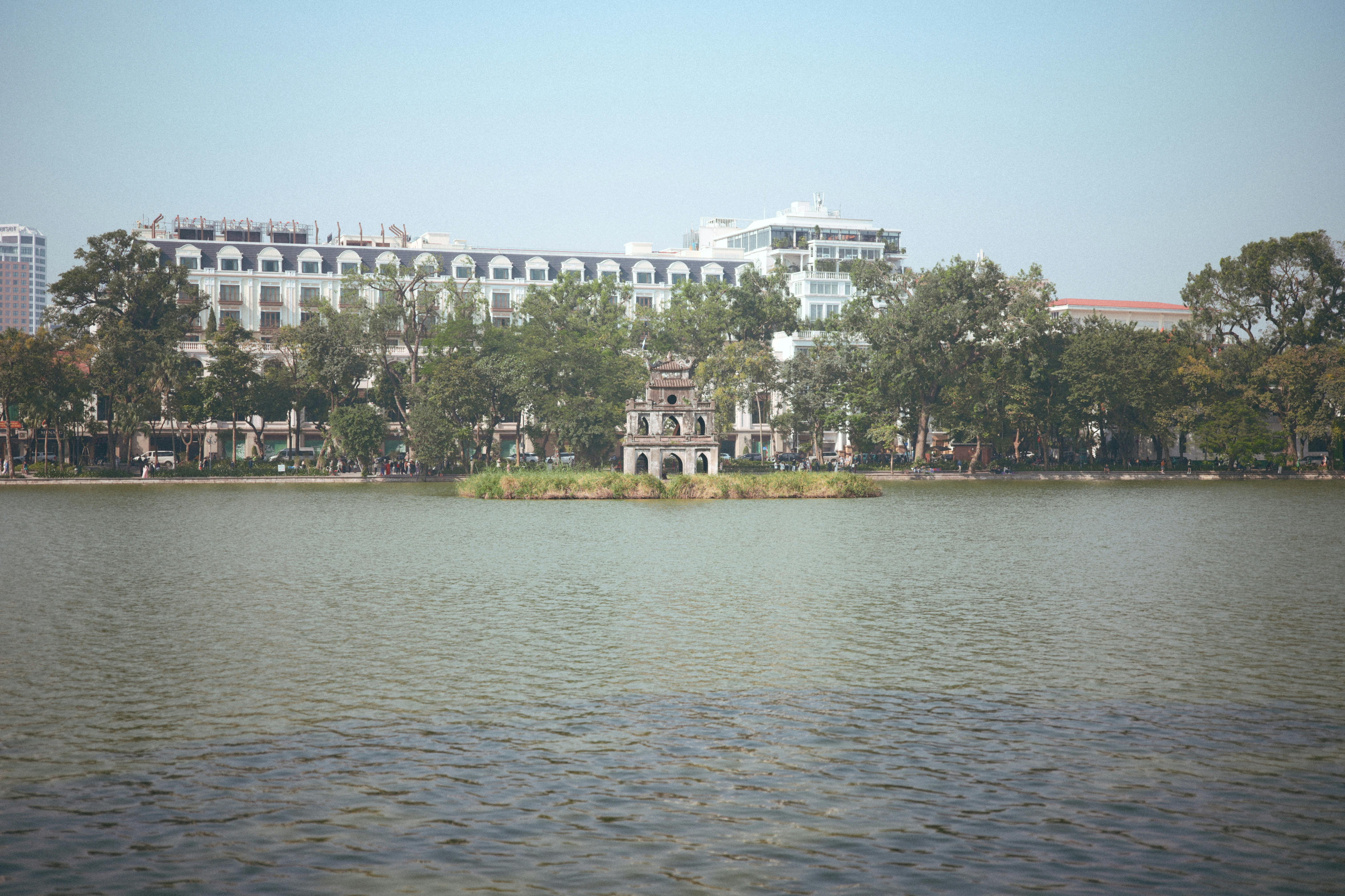 Scenic view of Hoan Kiem Lake with Turtle Tower, Hanoi, Vietnam.