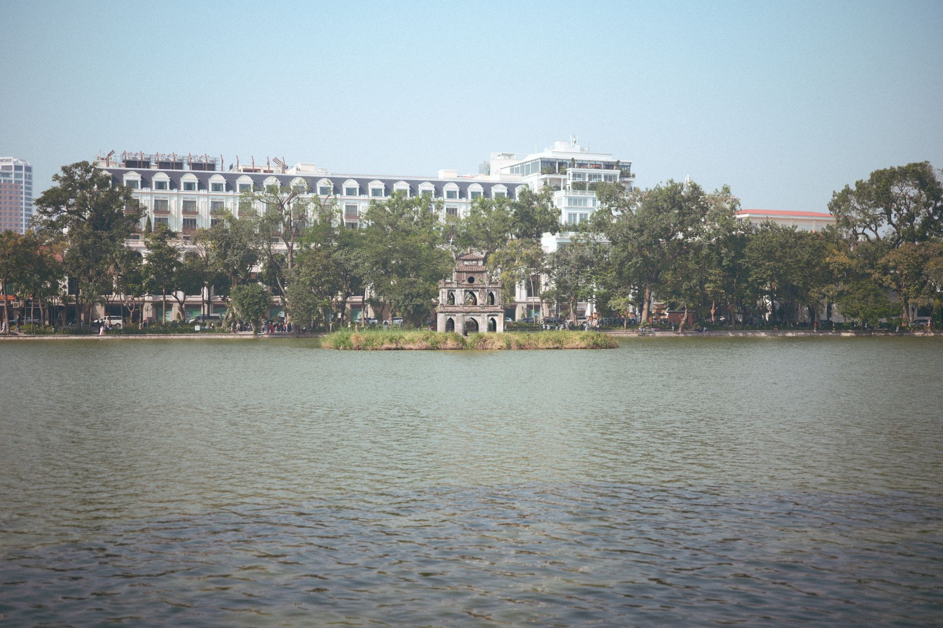 Scenic view of Hoan Kiem Lake with Turtle Tower, Hanoi, Vietnam.