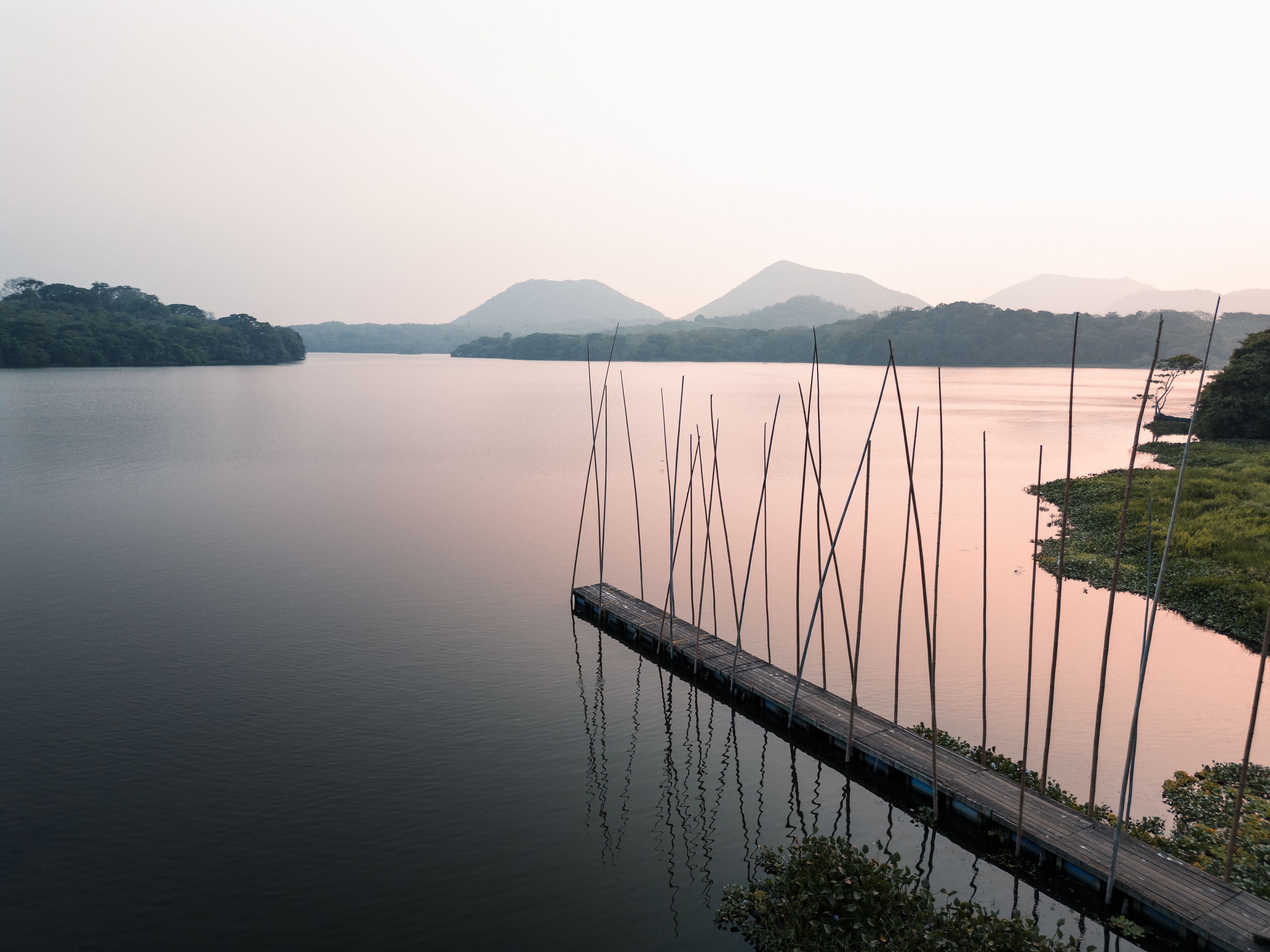 Serene Lake at Sunset with Mountains · Free Stock Photo