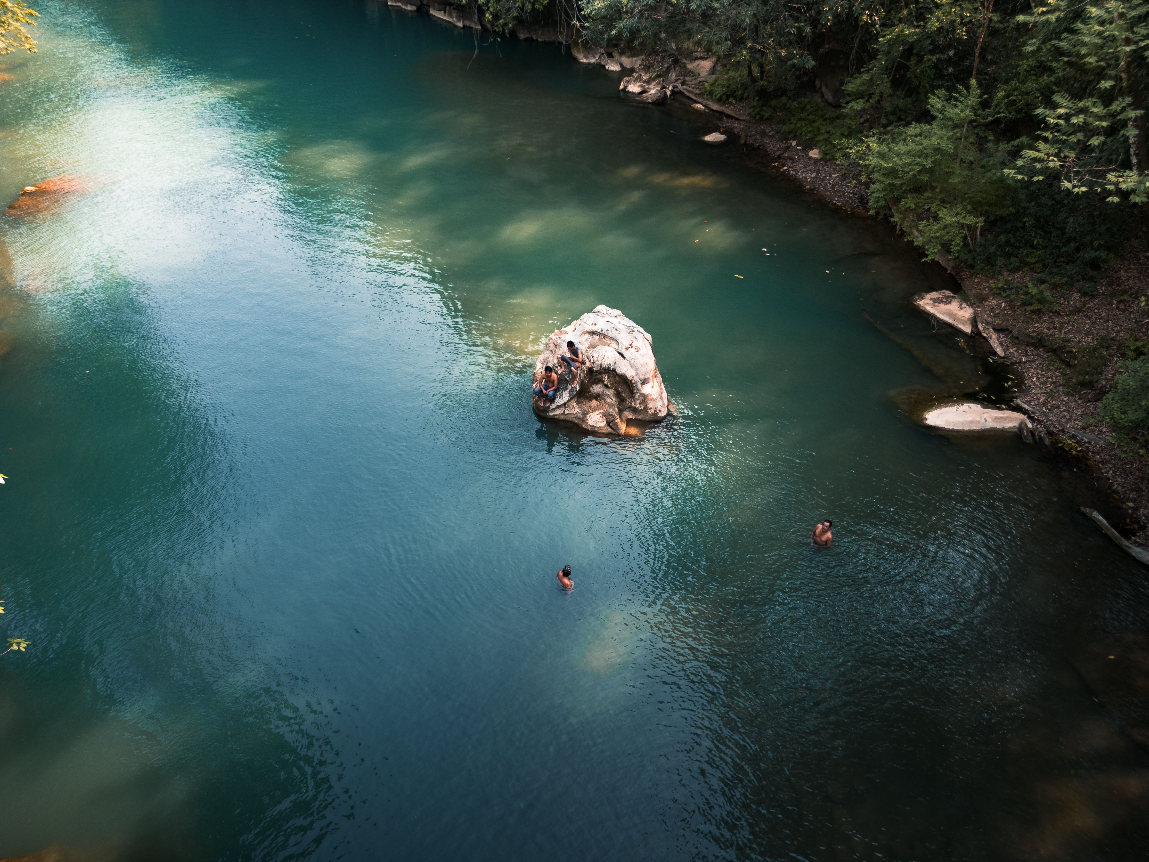 Aerial View of Swimmers in a Scenic River · Free Stock Photo