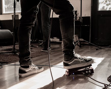 Live performance setup with musician using a guitar effects pedal in Uruguay.