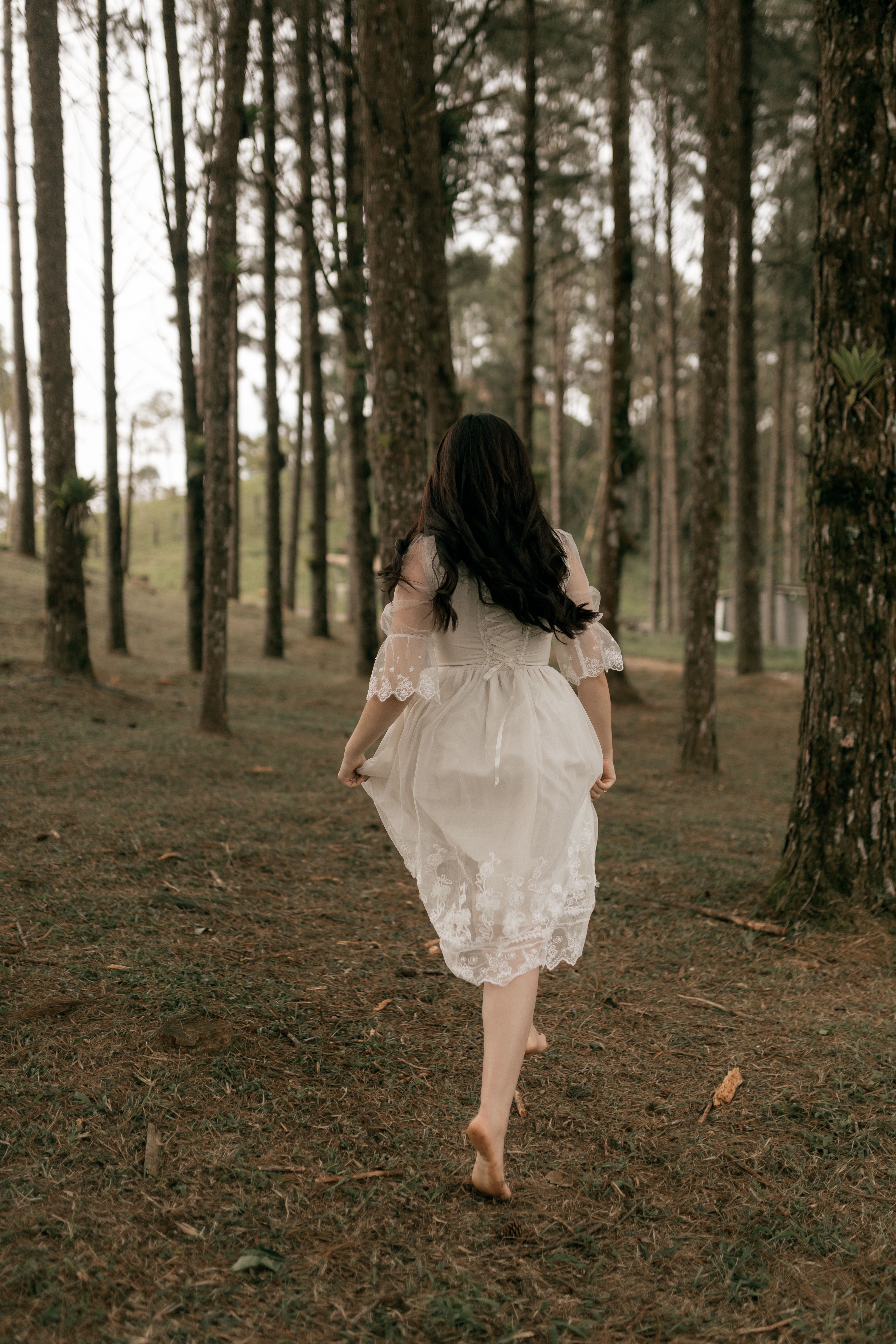 Girl in Blue Dress Walking on Green Grass Field · Free Stock Photo
