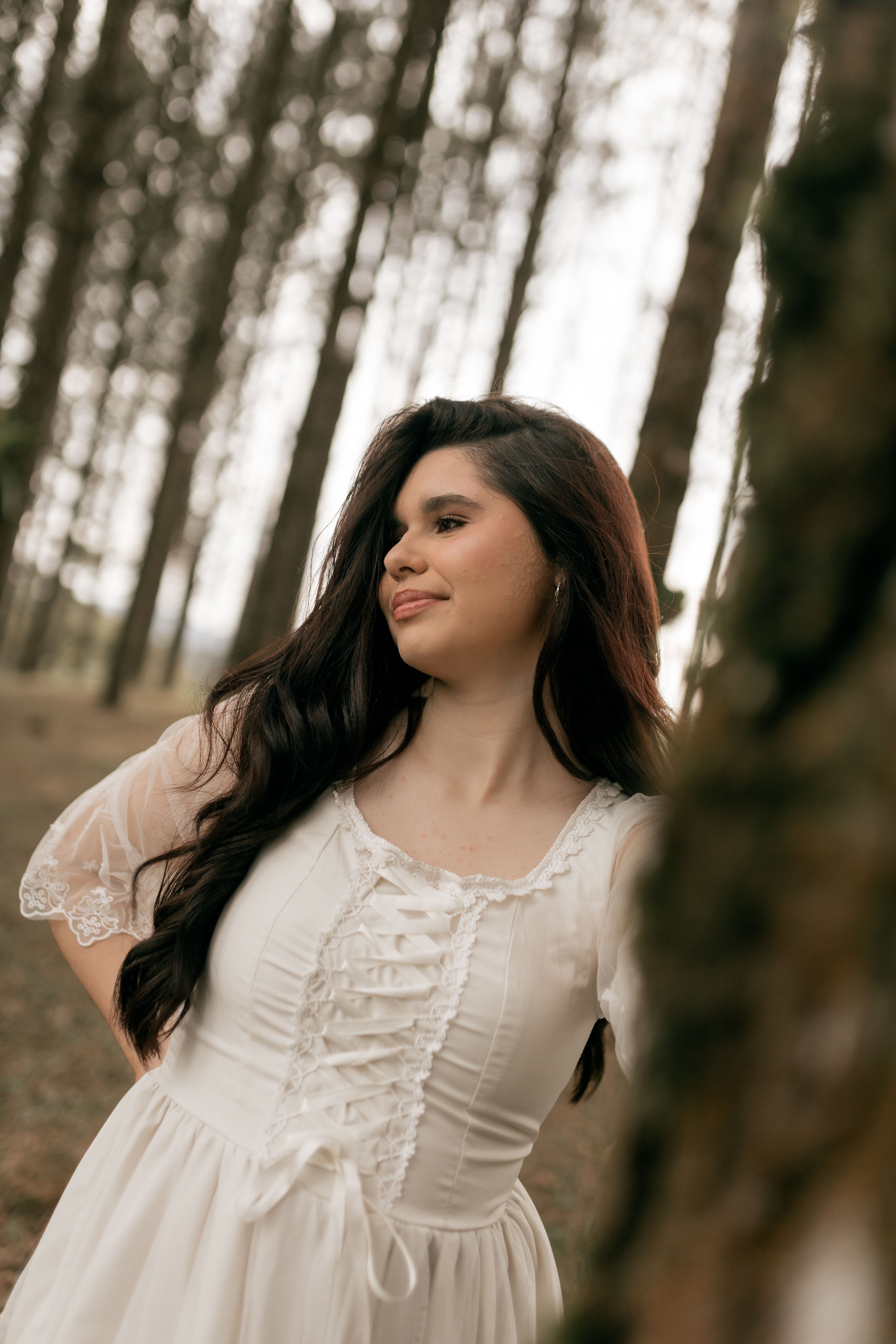 Woman in white dress posing in a forest setting · Free Stock Photo
