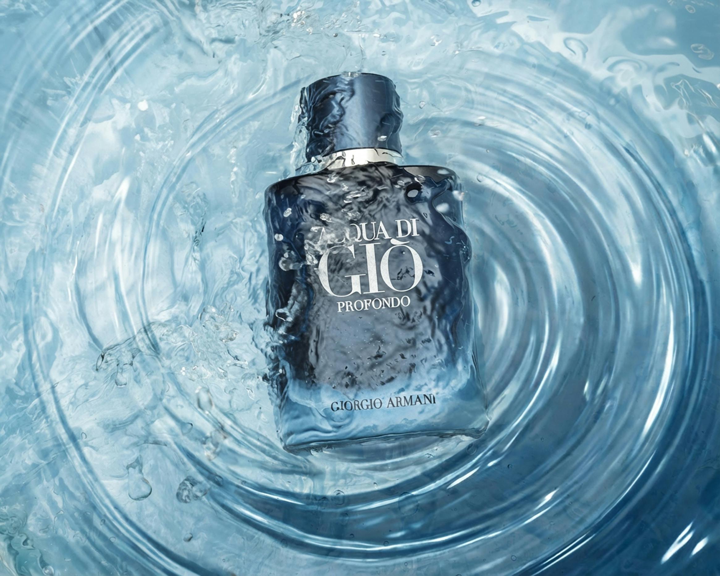 Elegant Aqua di Gio Profondo perfume bottle immersed in a captivating water splash, highlighting freshness.