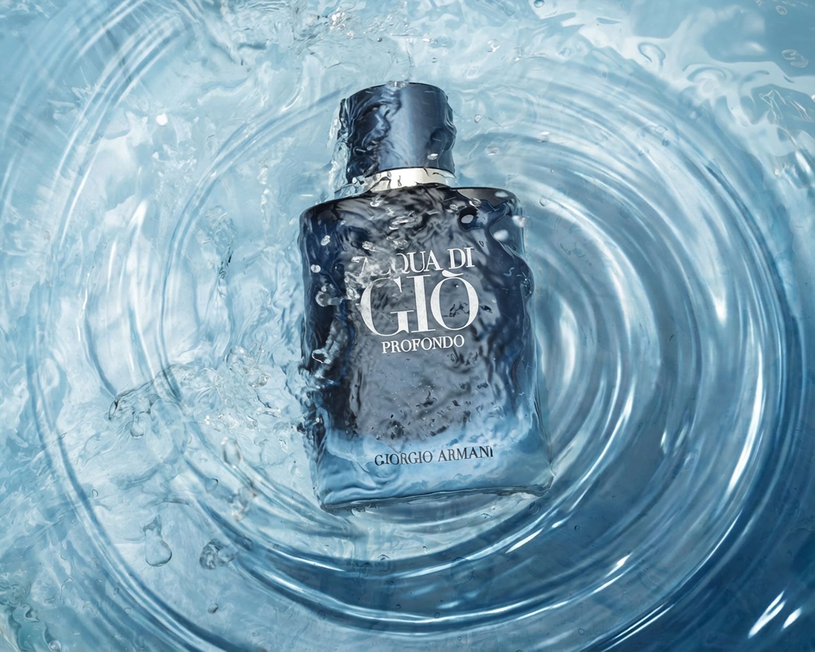 Elegant Aqua di Gio Profondo perfume bottle immersed in a captivating water splash, highlighting freshness.