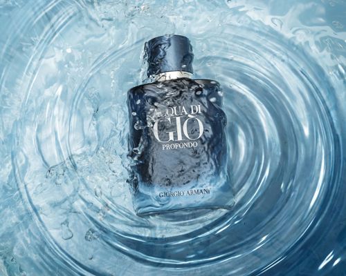 Free Elegant Aqua di Gio Profondo perfume bottle immersed in a captivating water splash, highlighting freshness. Stock Photo