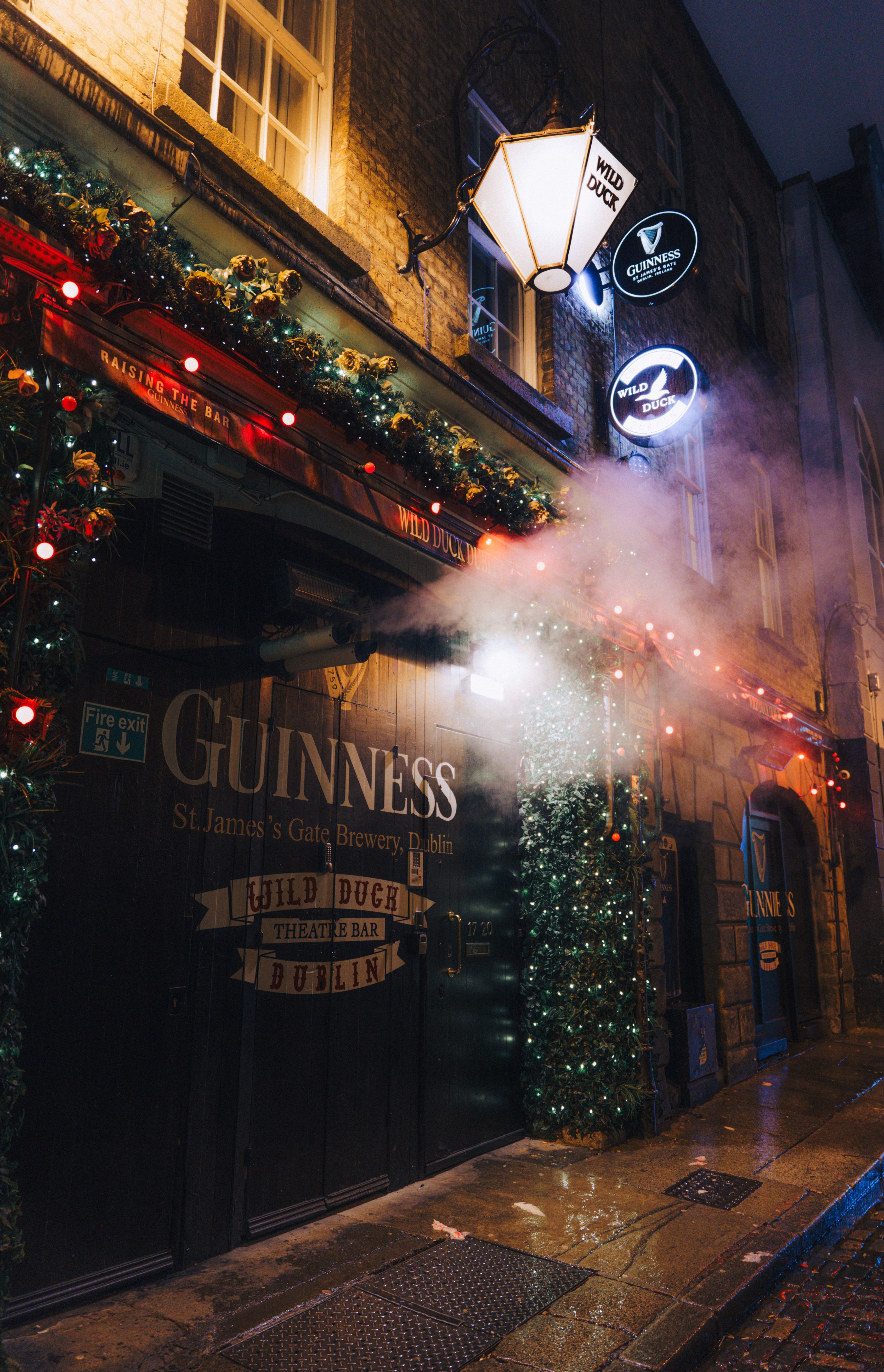 Festive Pub Exterior in Dublin at Night · Free Stock Photo