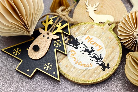 Handmade paper and wood Christmas ornaments for eco-friendly festive decor.