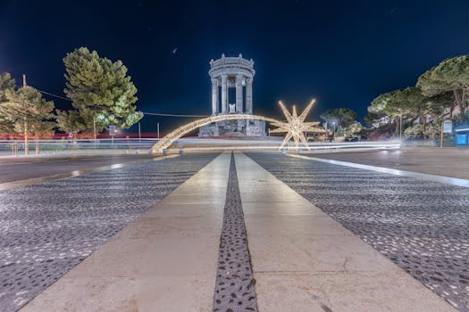 Long exposure night shot of Passetto Monument in Ancona, Italy with festive holiday lights.