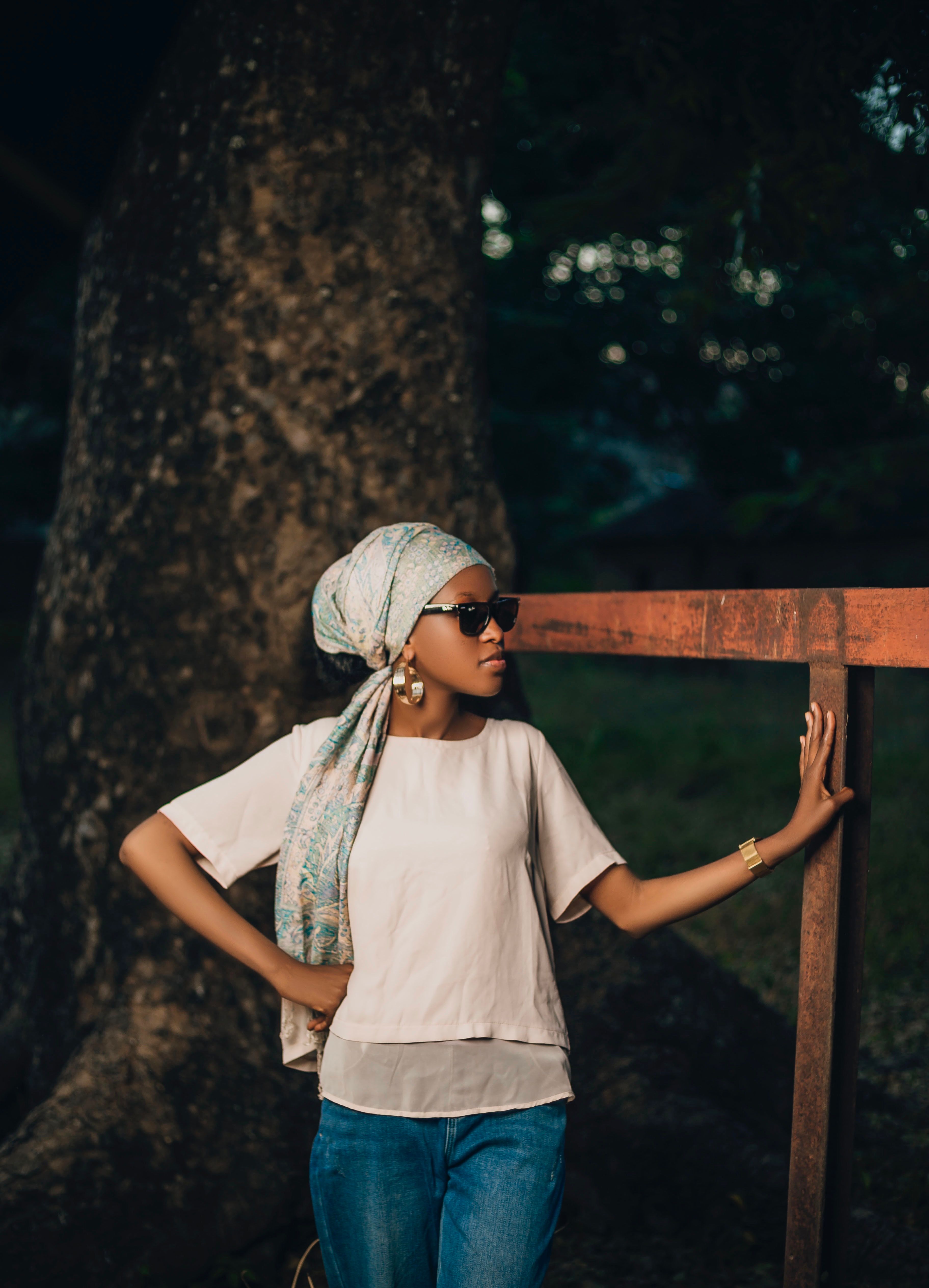 Stylish Woman Posing Outdoors in Sunglasses · Free Stock Photo