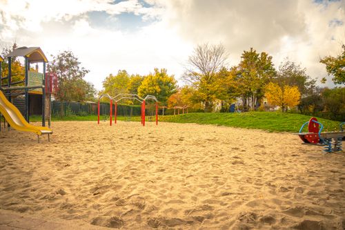 Free A serene playground scene under golden autumn foliage in Lower Saxony, Germany. Stock Photo