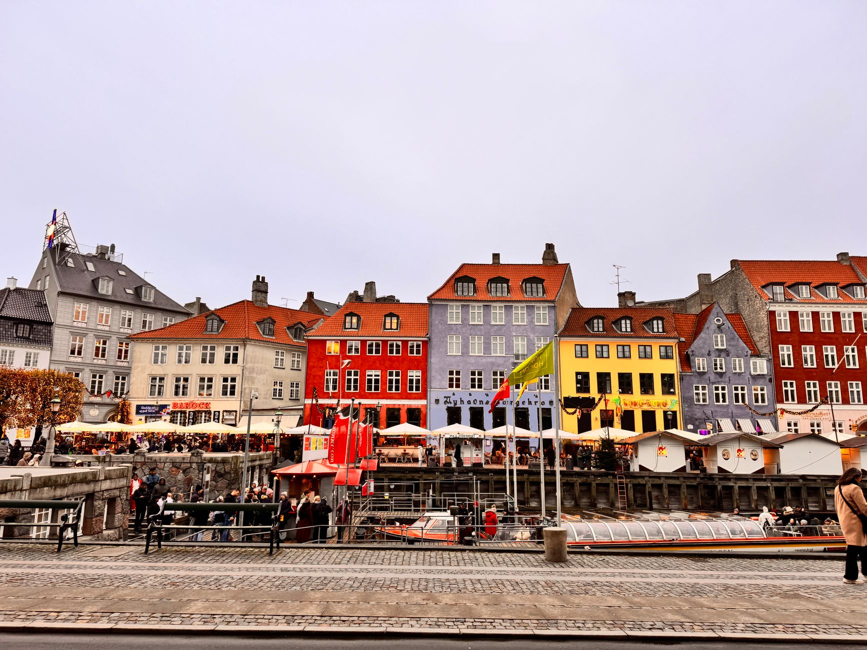 Colorful buildings along Nyhavn Harbor in Copenhagen, perfect for travel enthusiasts seeking unique cityscapes.