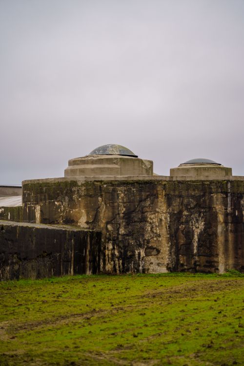 Free Explore a rugged concrete structure set in the lush countryside of Willebroek, Belgium. Stock Photo