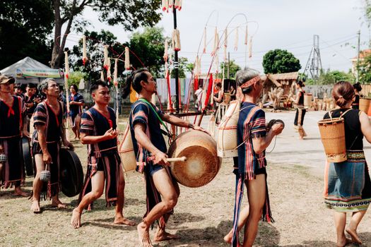 A vibrant traditional drum parade during a cultural festival in Kon Tum, Vietnam.