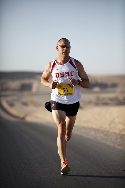 Free Man in White Jersey While Running Stock Photo