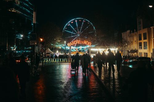 Free Explore the vibrant Christmas market with a glowing Ferris wheel in Rennes, France, at night. Stock Photo