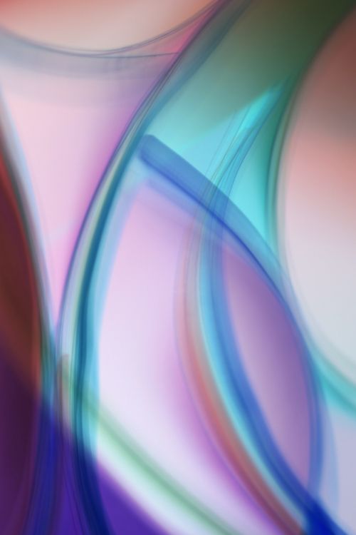 Free A vibrant abstract composition of colorful light waves blending fluidly. Stock Photo
