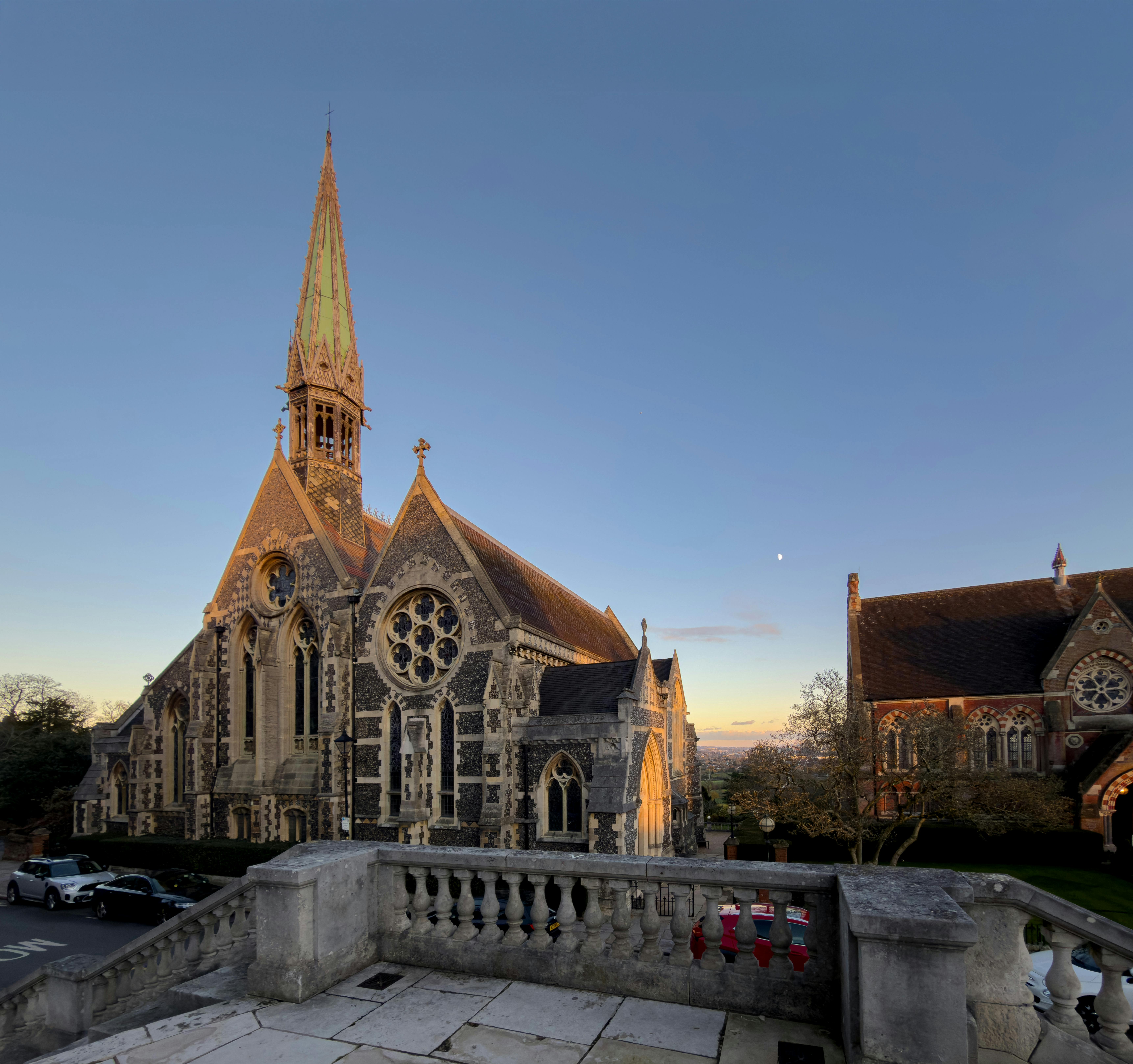 The iconic Harrow School Chapel at dusk with beautiful architectural details.