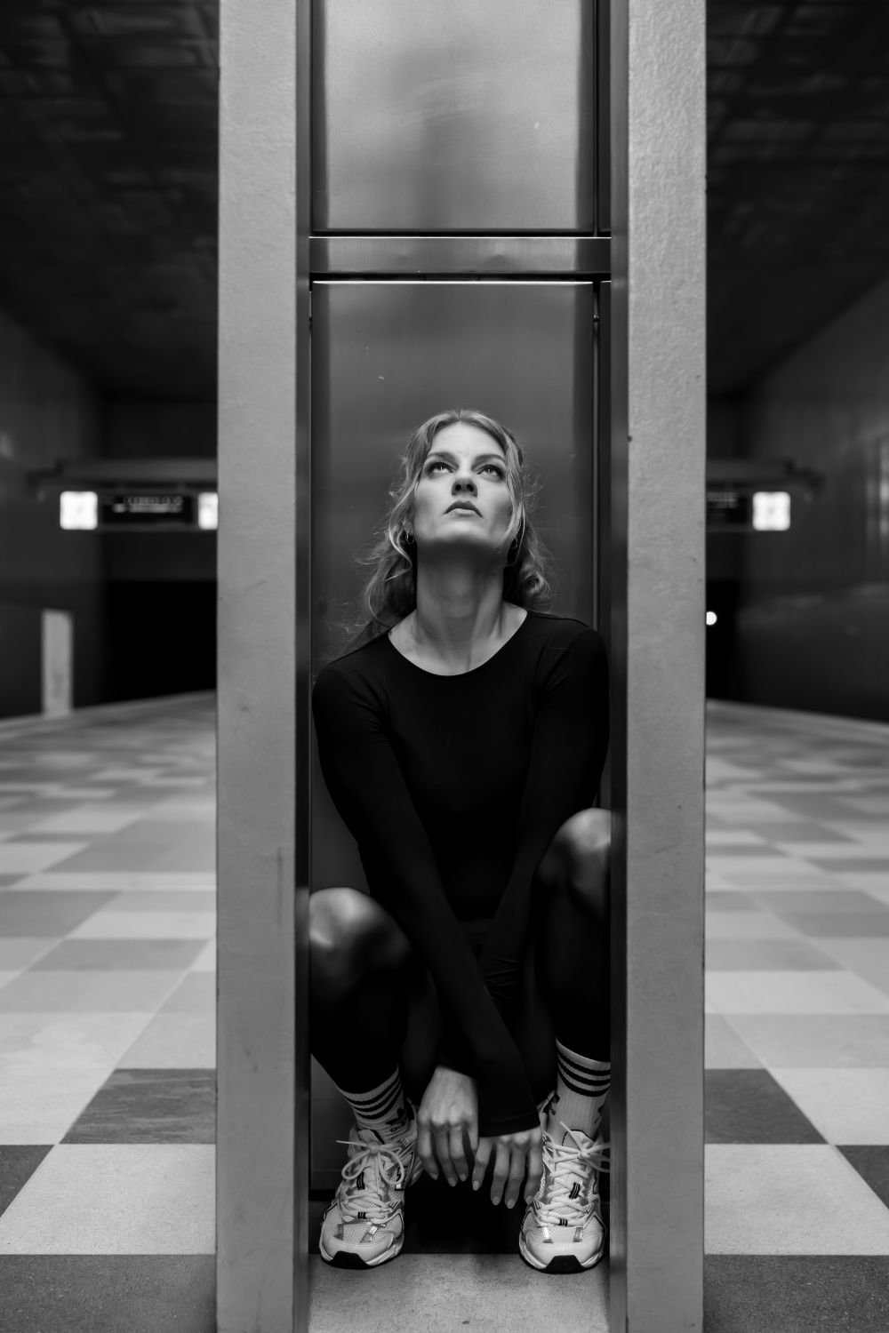 Contemplative Woman in Urban Underground Setting · Free Stock Photo