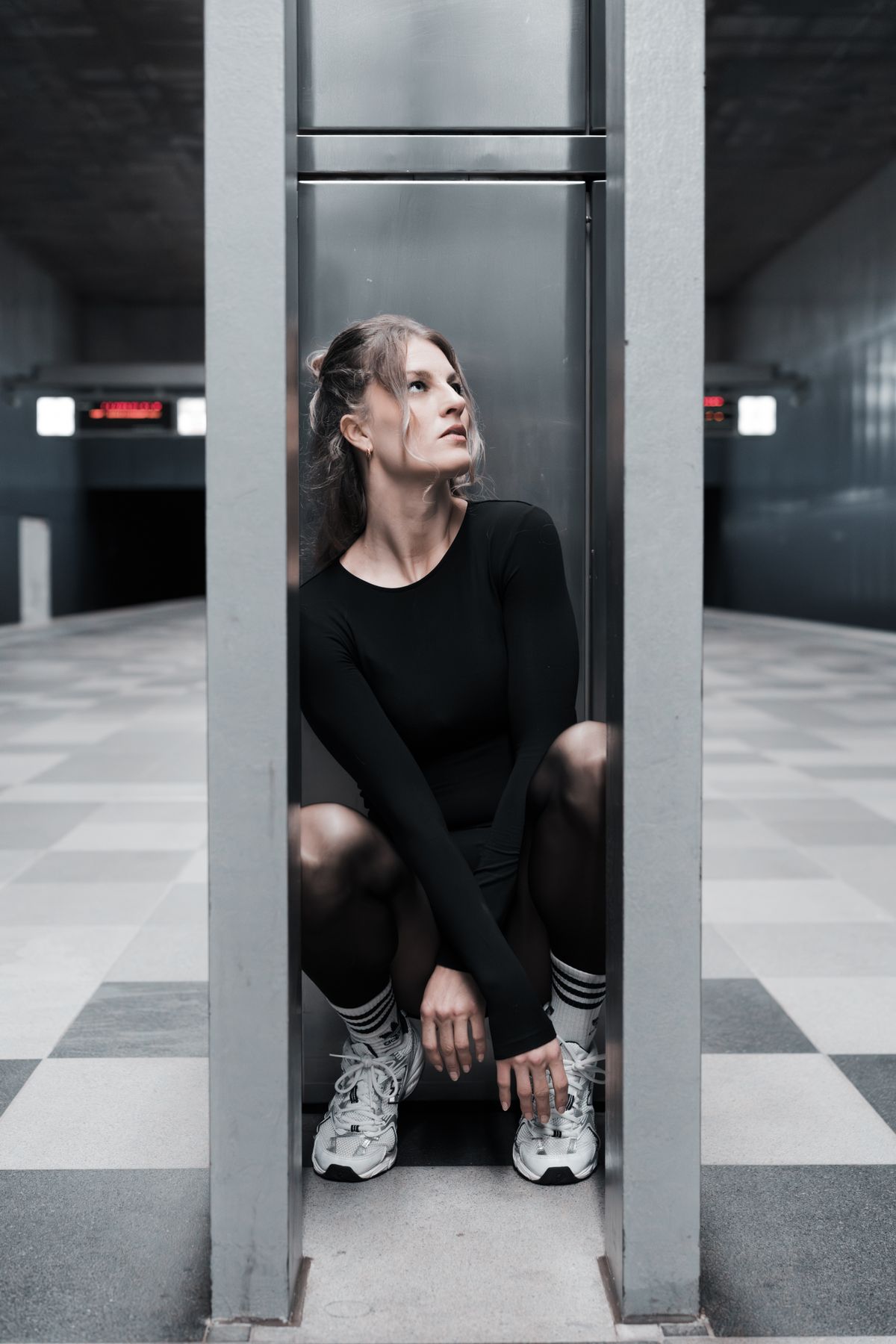 Contemplative Woman in Urban Underground Setting · Free Stock Photo