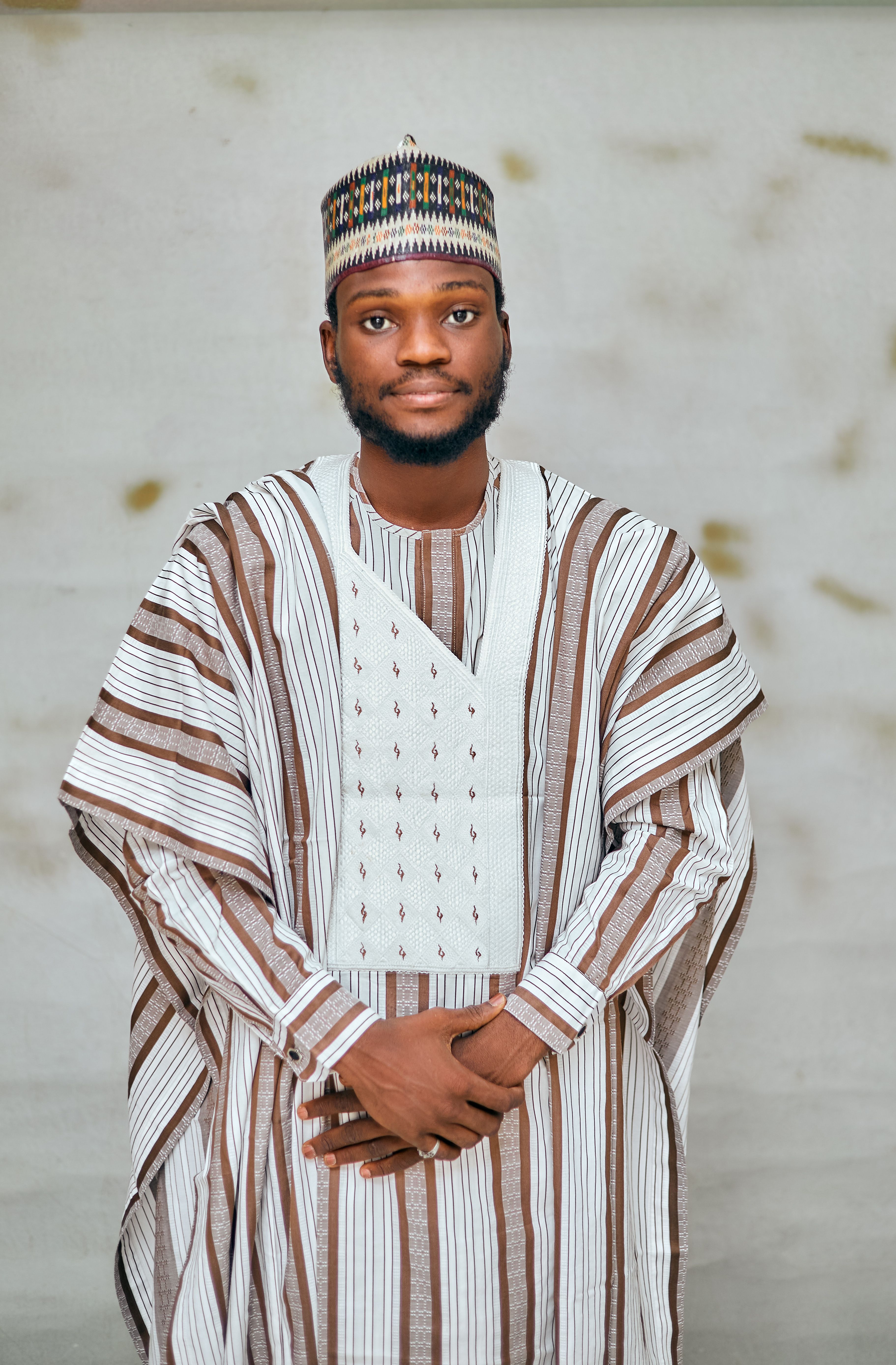 Portrait of a man in traditional Nigerian agbada, showcasing cultural elegance.