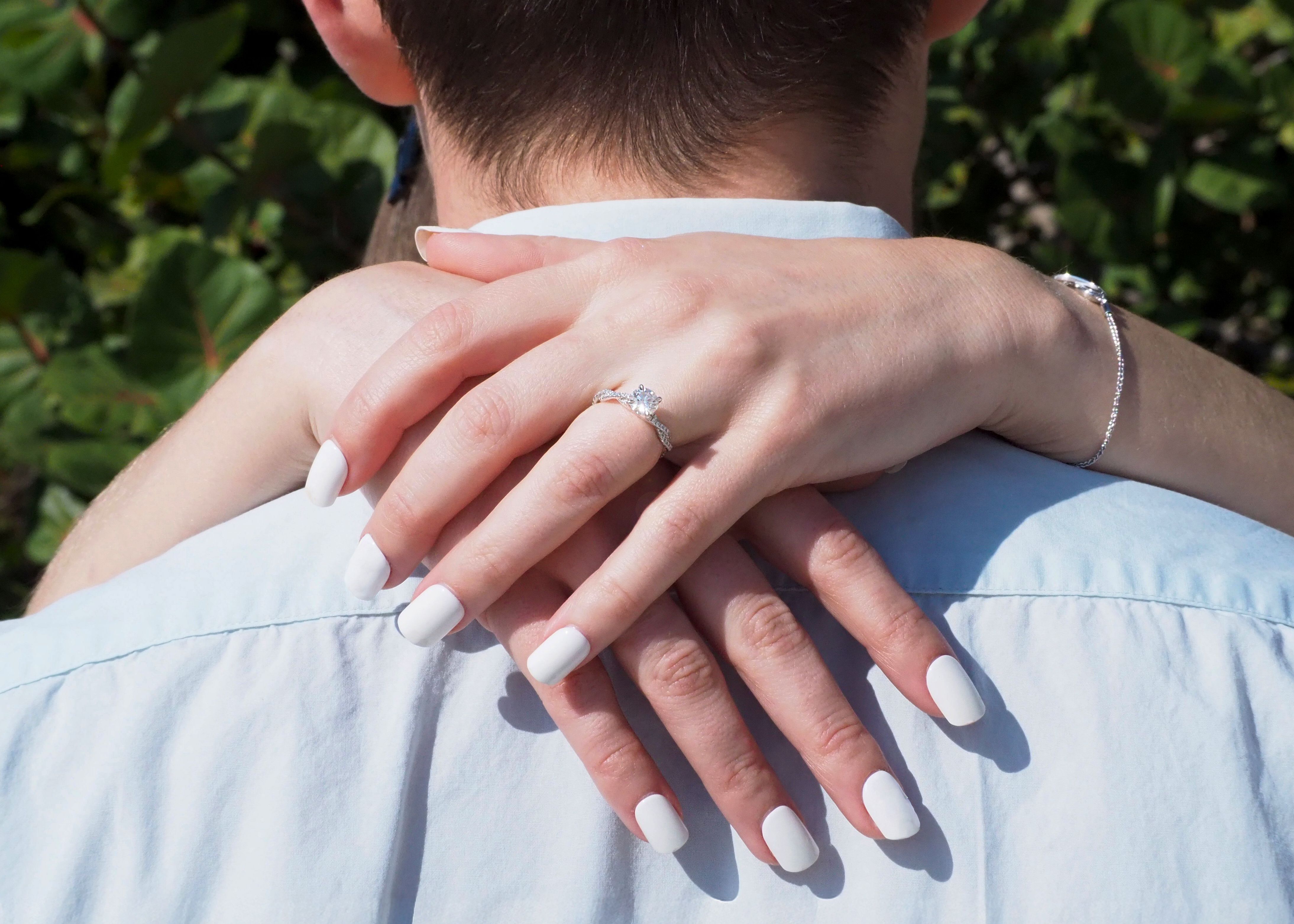 Romantic Engagement Hug with Diamond Ring · Free Stock Photo