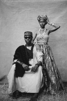 Black and white portrait showcasing traditional Nigerian attire, highlighting cultural fashion.