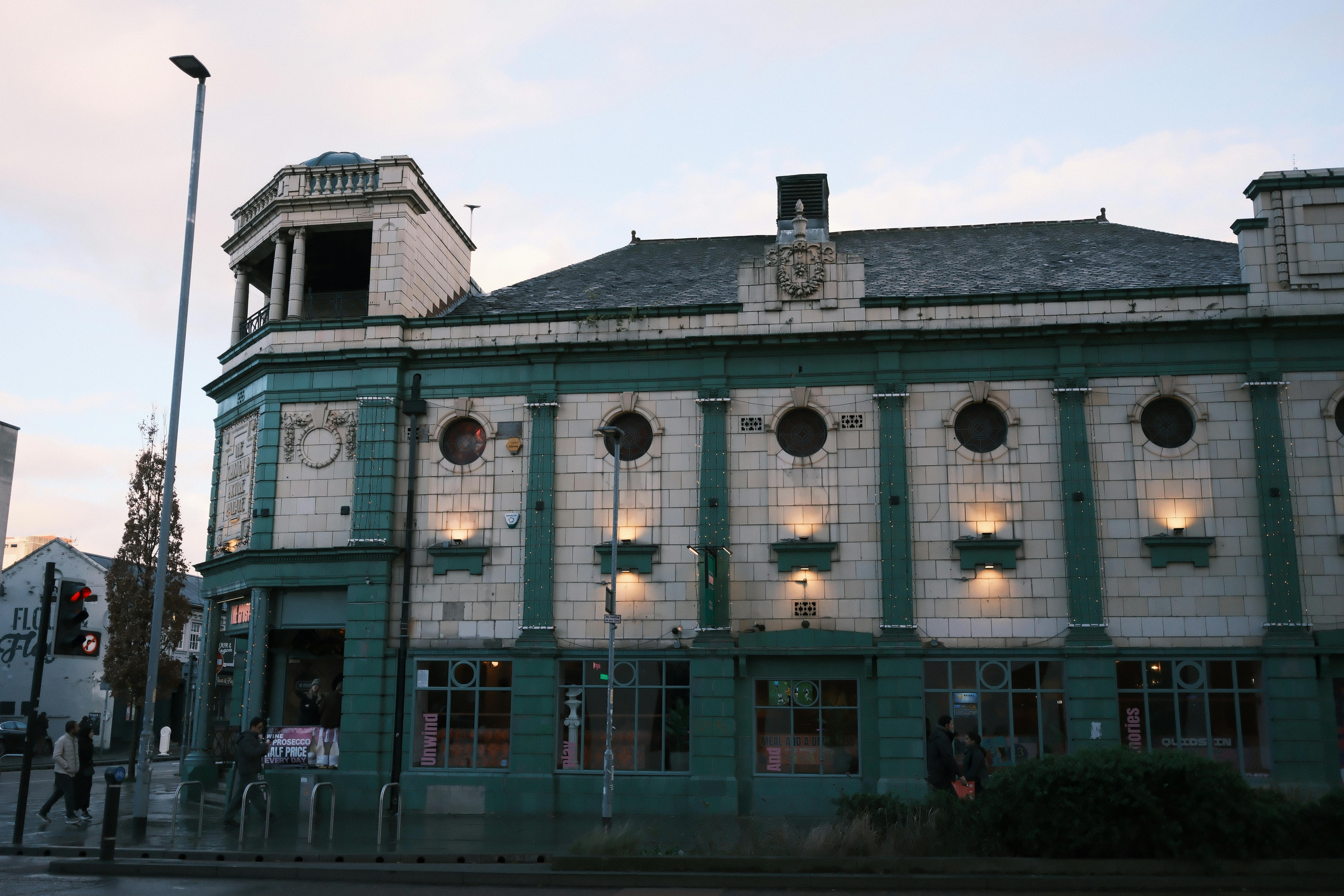 Free Historic theater building with intricate vintage architecture illuminated during the day. Stock Photo
