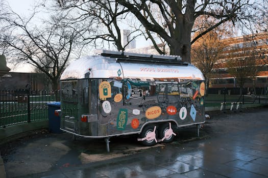 A vintage food truck selling burritos in a city park, showcasing a retro and urban vibe.