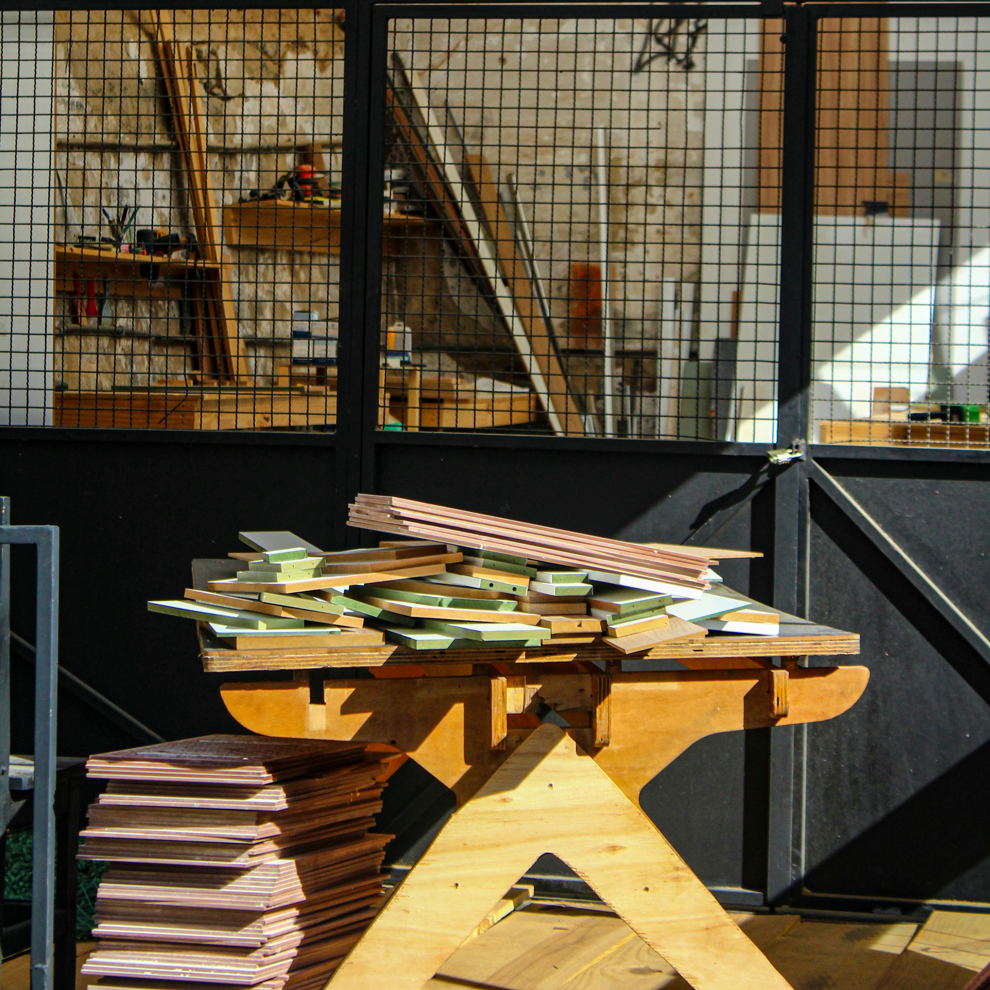A workbench stacked with leftover timber and tools, mirroring the reuse logic that Melbourne Design Week turns into public conversation.