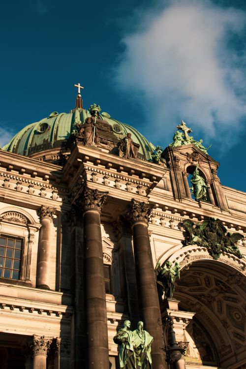 Free Majestic architectural detail of Berlin Cathedral with vibrant sky backdrop. Stock Photo
