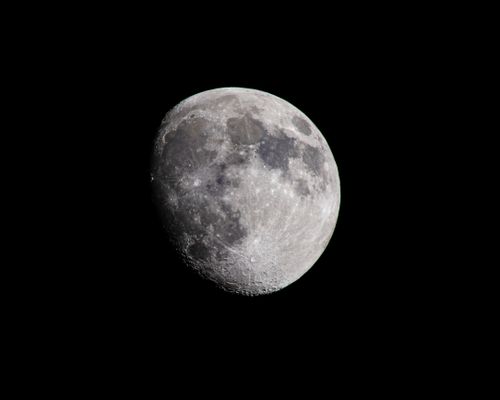 Free Detailed image of the moon's surface during a gibbous phase, showcasing craters and texture. Stock Photo