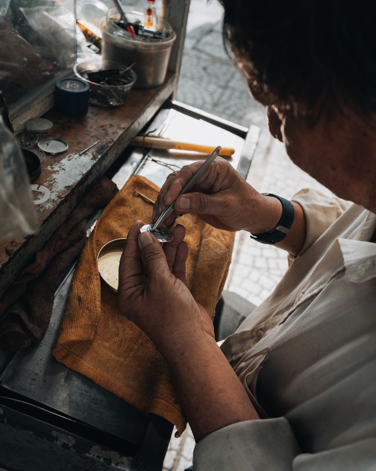 Watchmaker refinishing a watch case at Saltzman's Watches in Rhode Island