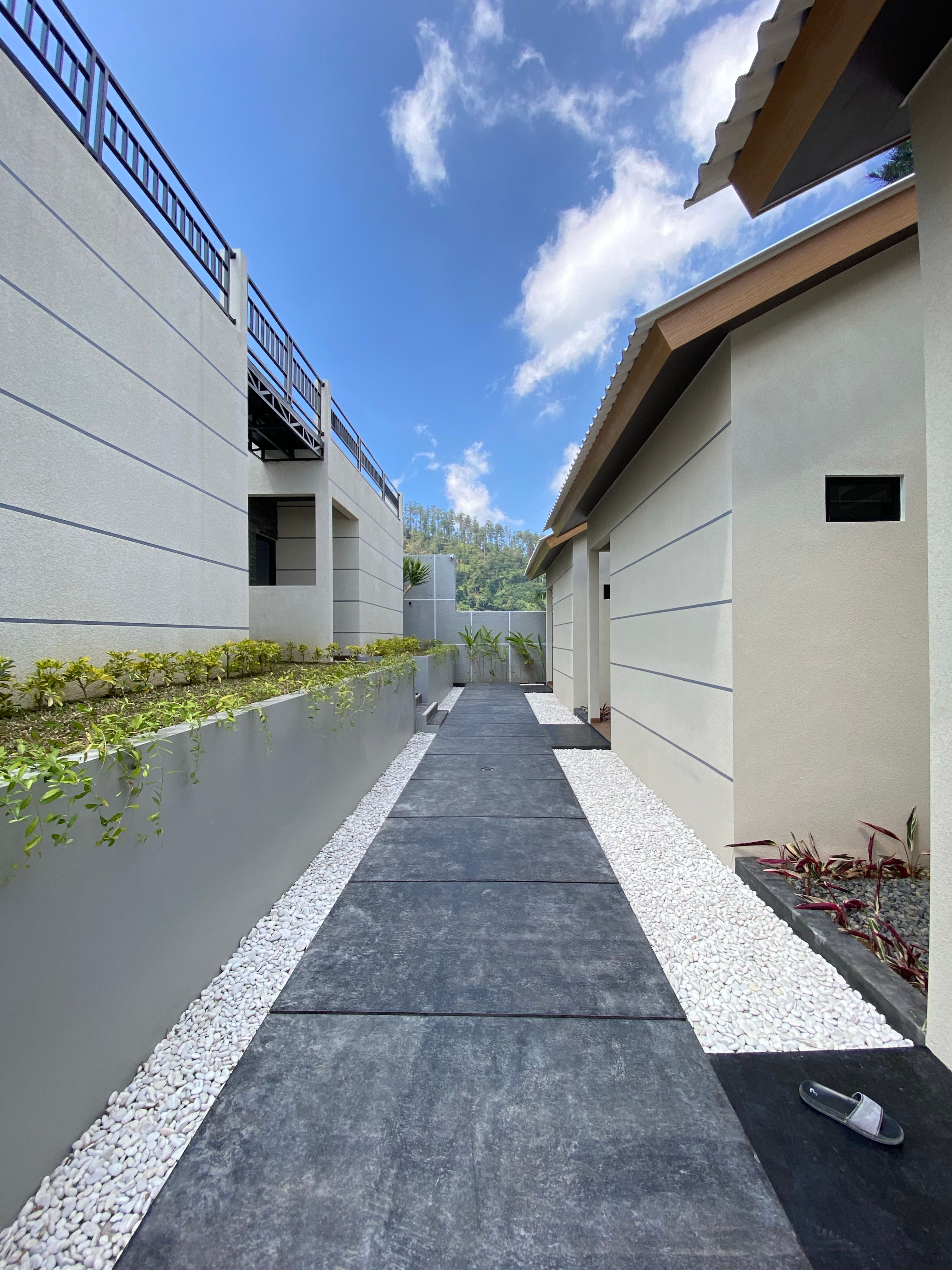 Modern Concrete Pathway Between Buildings · Free Stock Photo