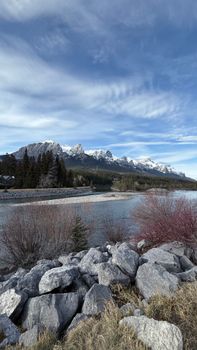 Stunning landscape of snow-capped mountains and river in Banff National Park.