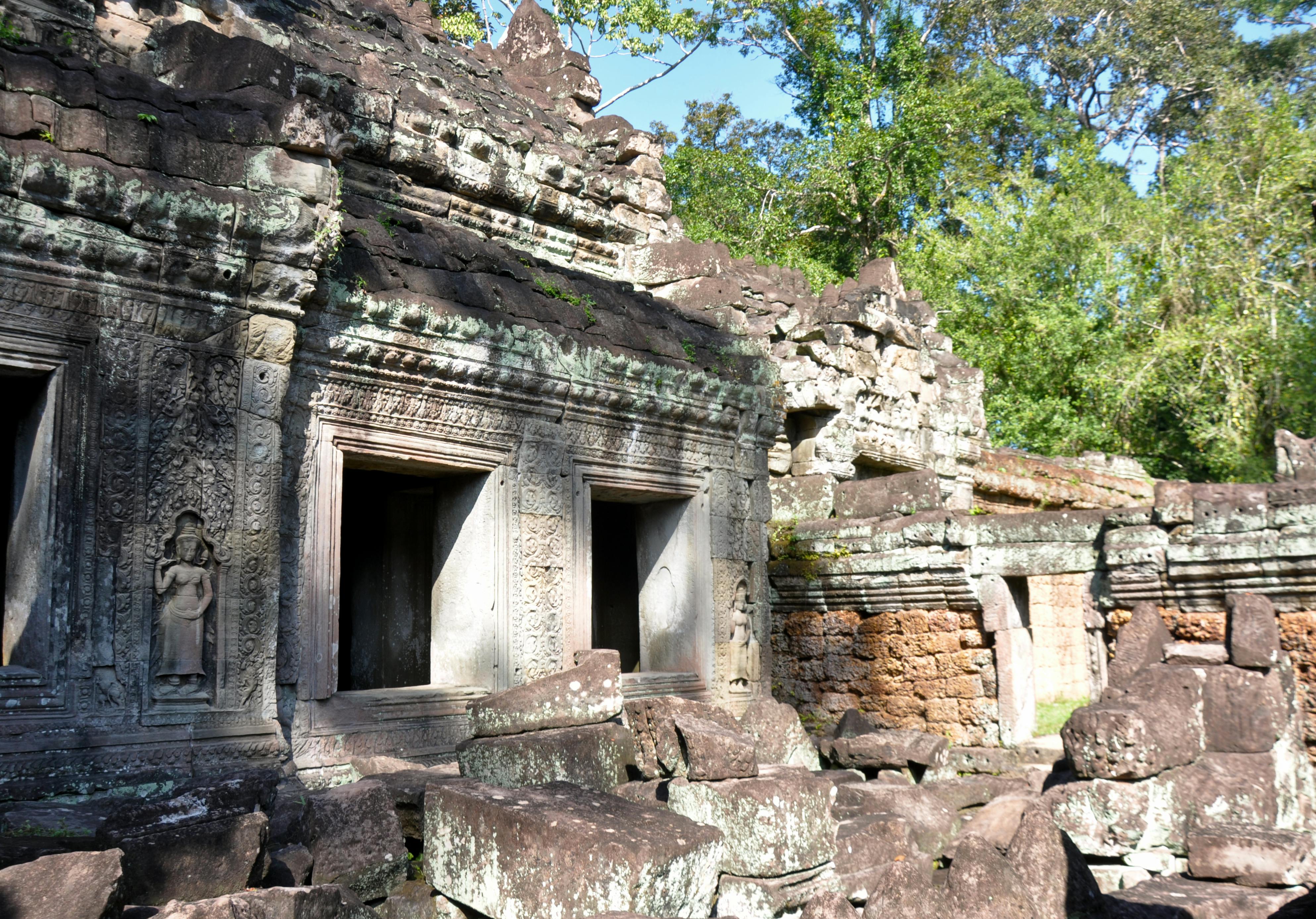 Explore the intricate stone carvings at the ancient Khmer ruins in Siem Reap, a stunning UNESCO site. - Siem Reap