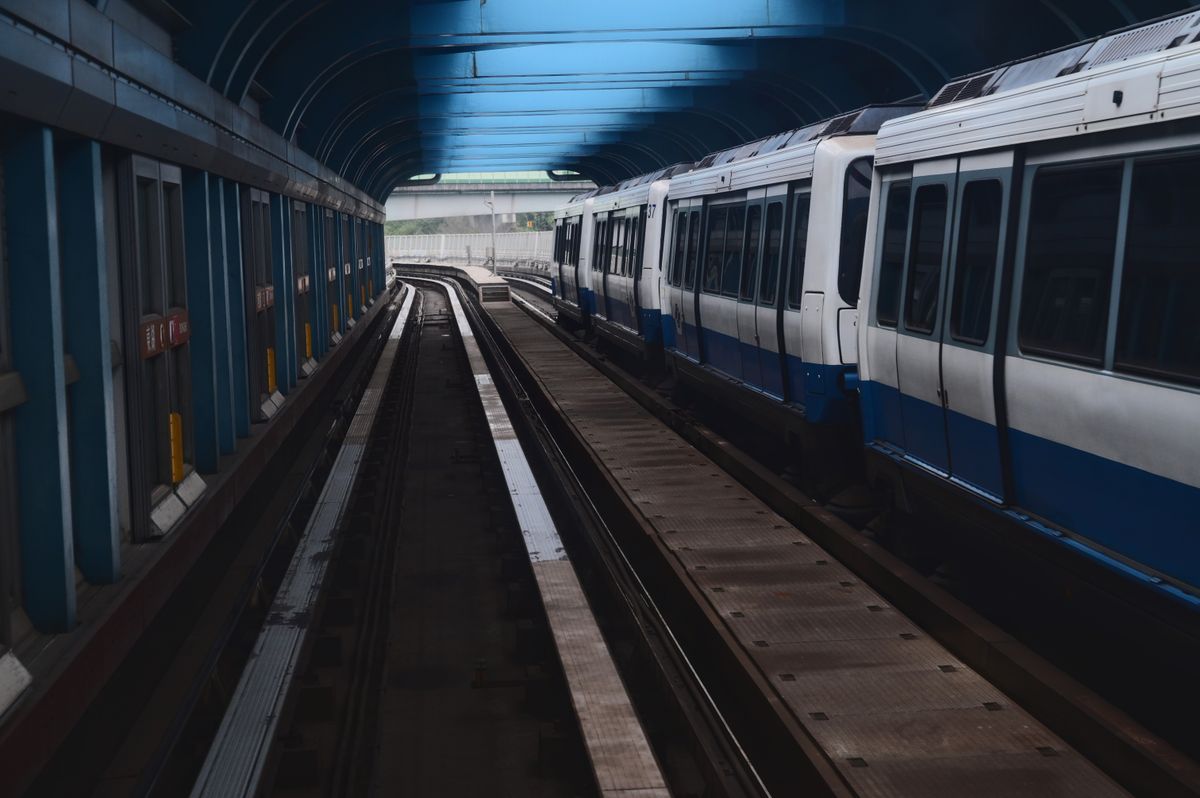 Taipei MRT metro train passing through a station tunnel