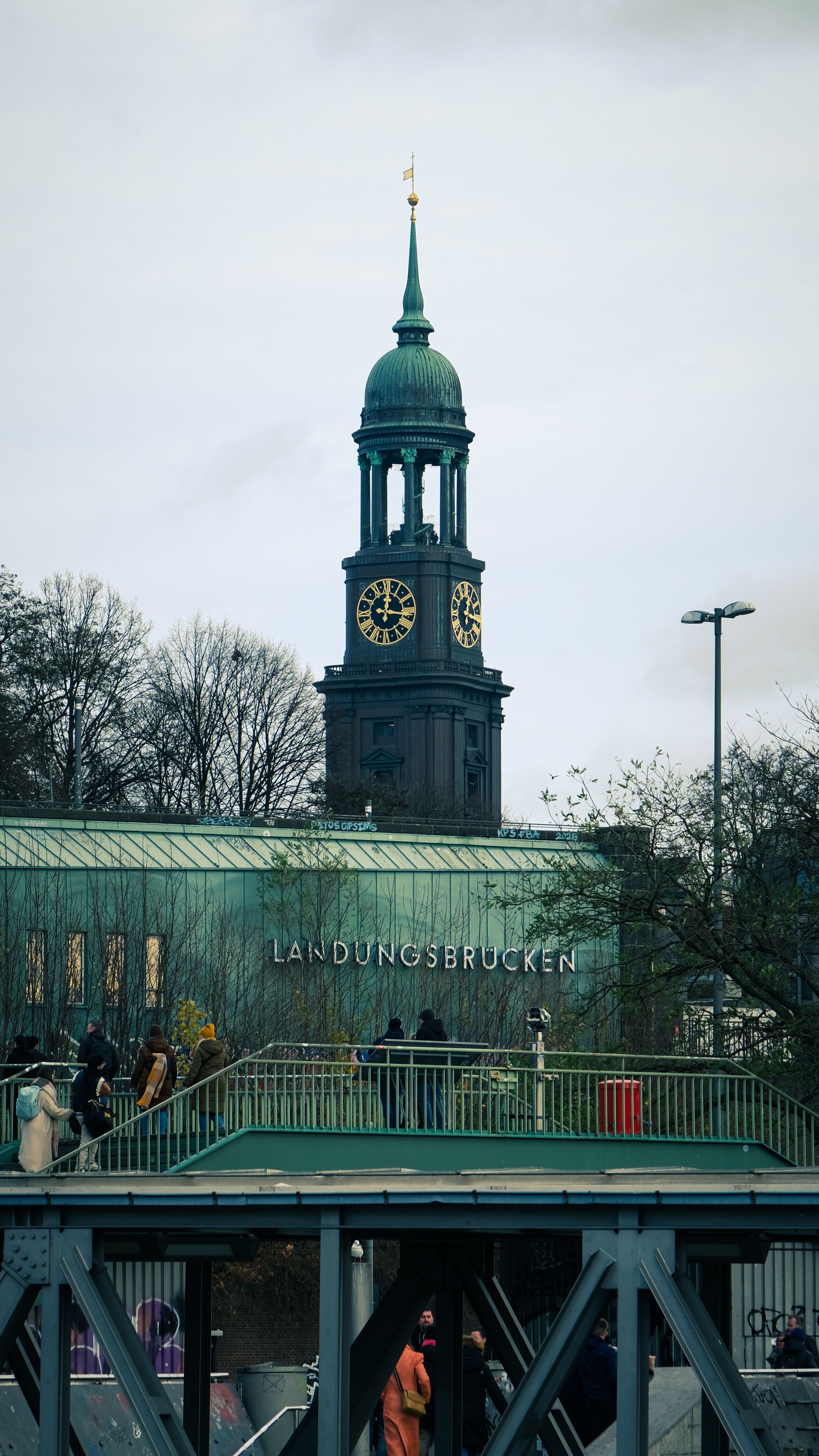 View of the iconic St. Michael's Church tower in Hamburg's Landungsbrücken area.