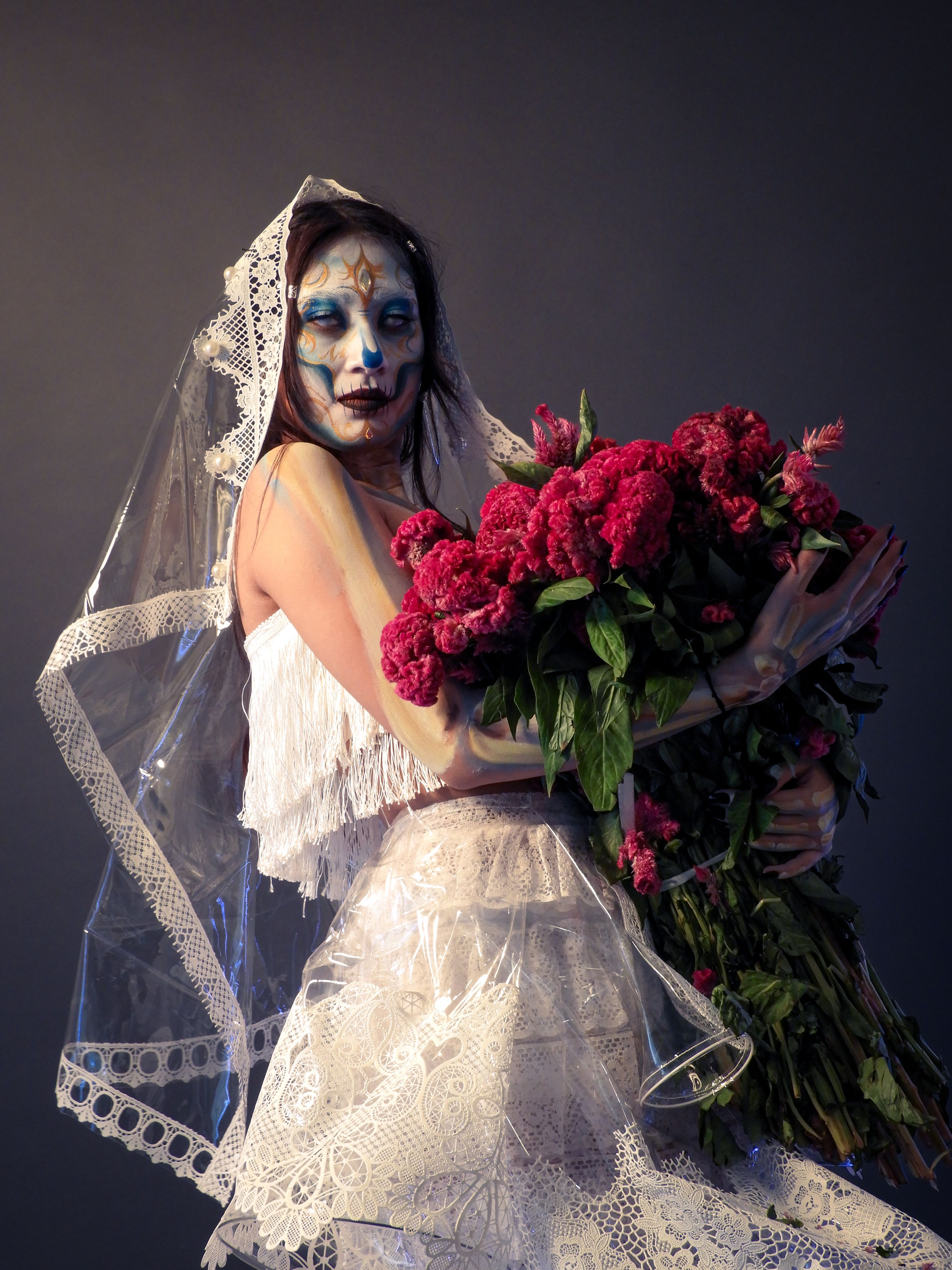 Day of the Dead Bride with Floral Bouquet · Free Stock Photo