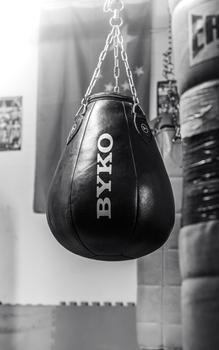 Monochrome image of a boxing bag in a Manchester gym.