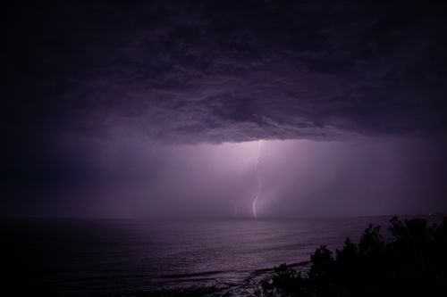 Free Dramatic lightning storm captured over the ocean at Culburra Beach, NSW, Australia. Stock Photo