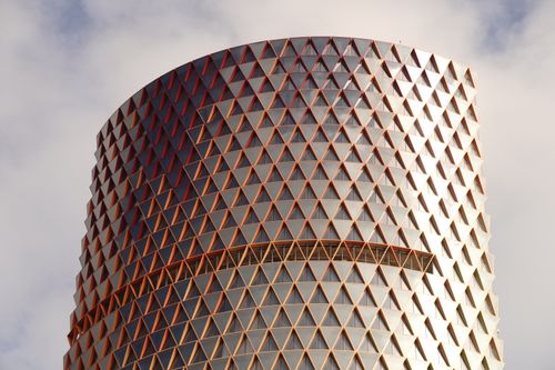 Free Dramatic view of a modern building with unique geometric design and triangle patterns. Stock Photo