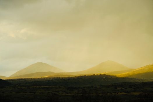 Captivating view of a mountain landscape bathed in warm golden light.