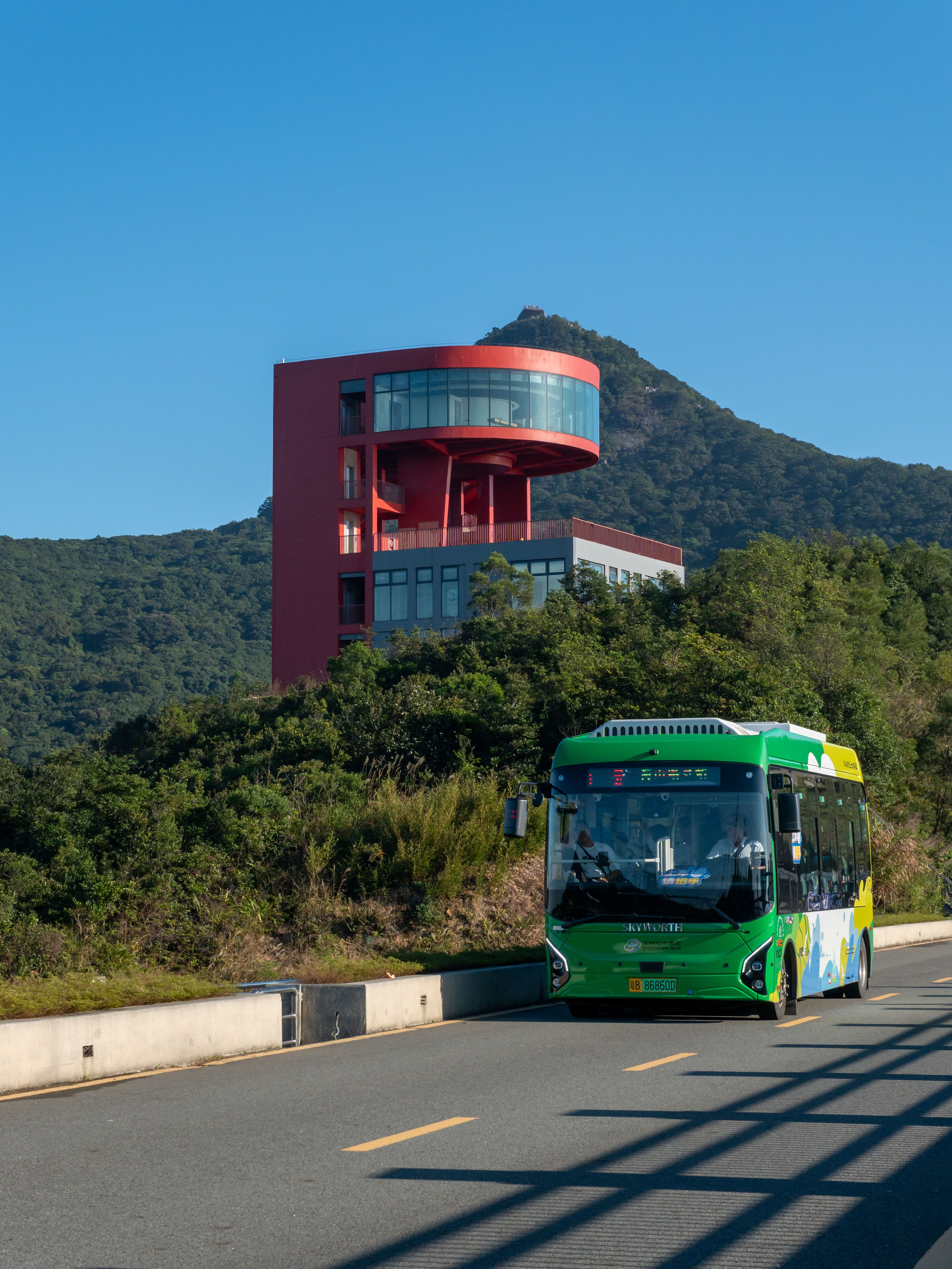Modern Building and Scenic Bus Ride · Free Stock Photo