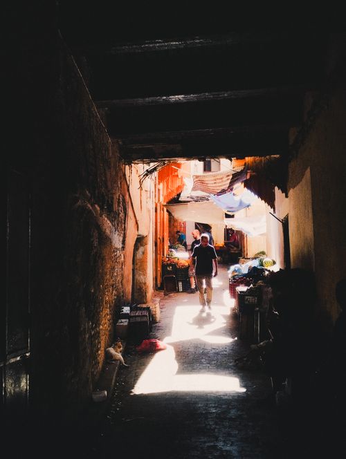 Free A shadowy alleyway in the Fes Medina, Morocco, capturing the cultural atmosphere. Stock Photo