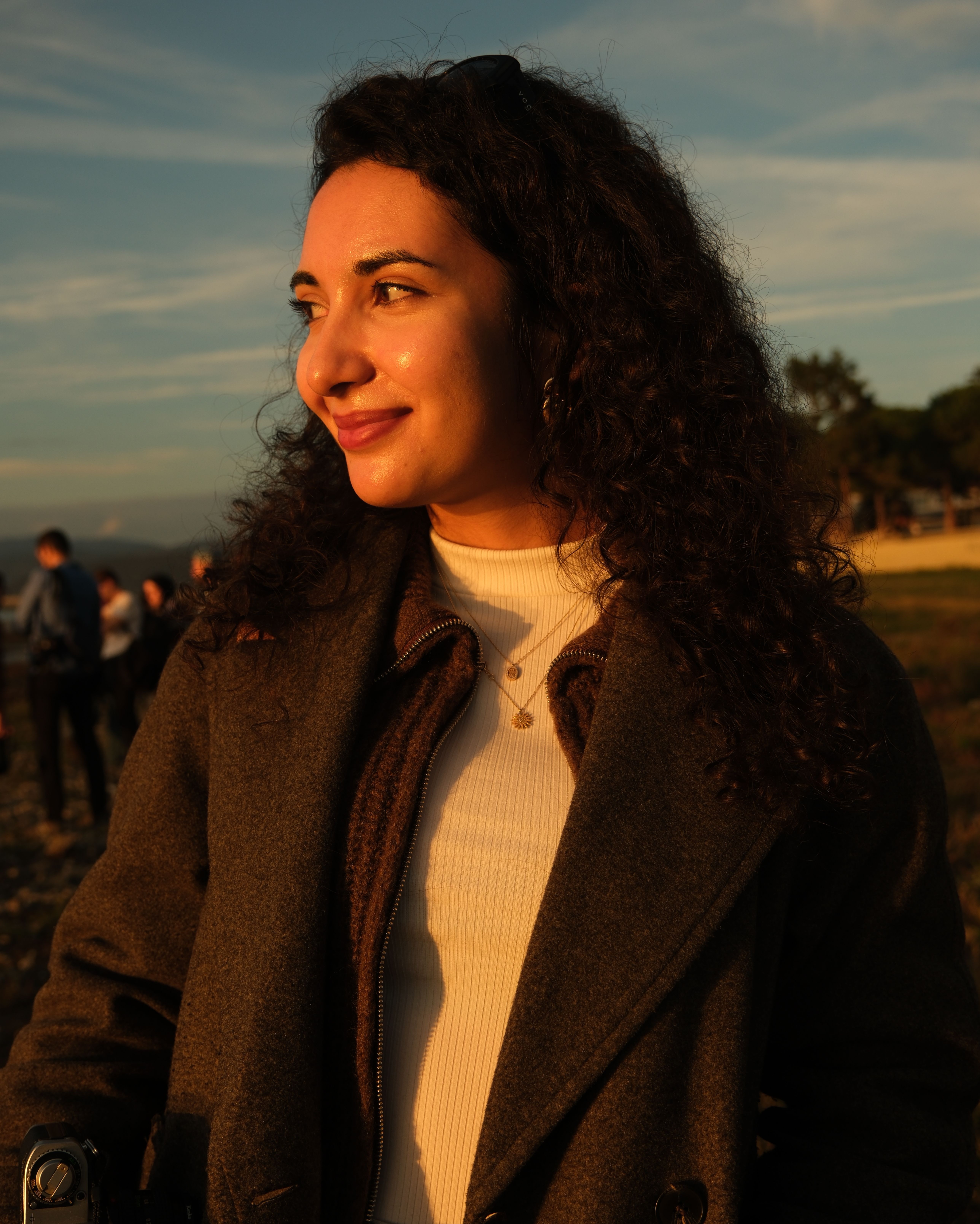 Warm Sunset Portrait of a Smiling Woman Outdoors