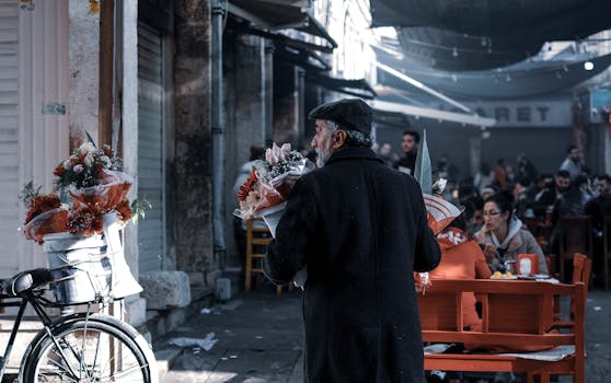 A street vendor offers flowers in a vibrant market. Captures urban lifestyle.